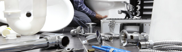 Bigstock Plumber At Work In A Bathroom 235131790